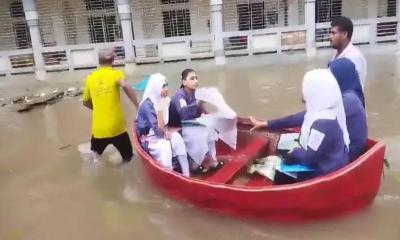 কুমিল্লায় টানা বৃষ্টিতে জলাবদ্ধতা, নৌকা ও ভ্যানে চড়ে পরীক্ষাকেন্দ্রে শিক্ষার্থীরা